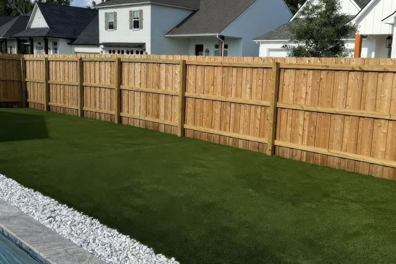 Finished artificial turf beside the pool after installation