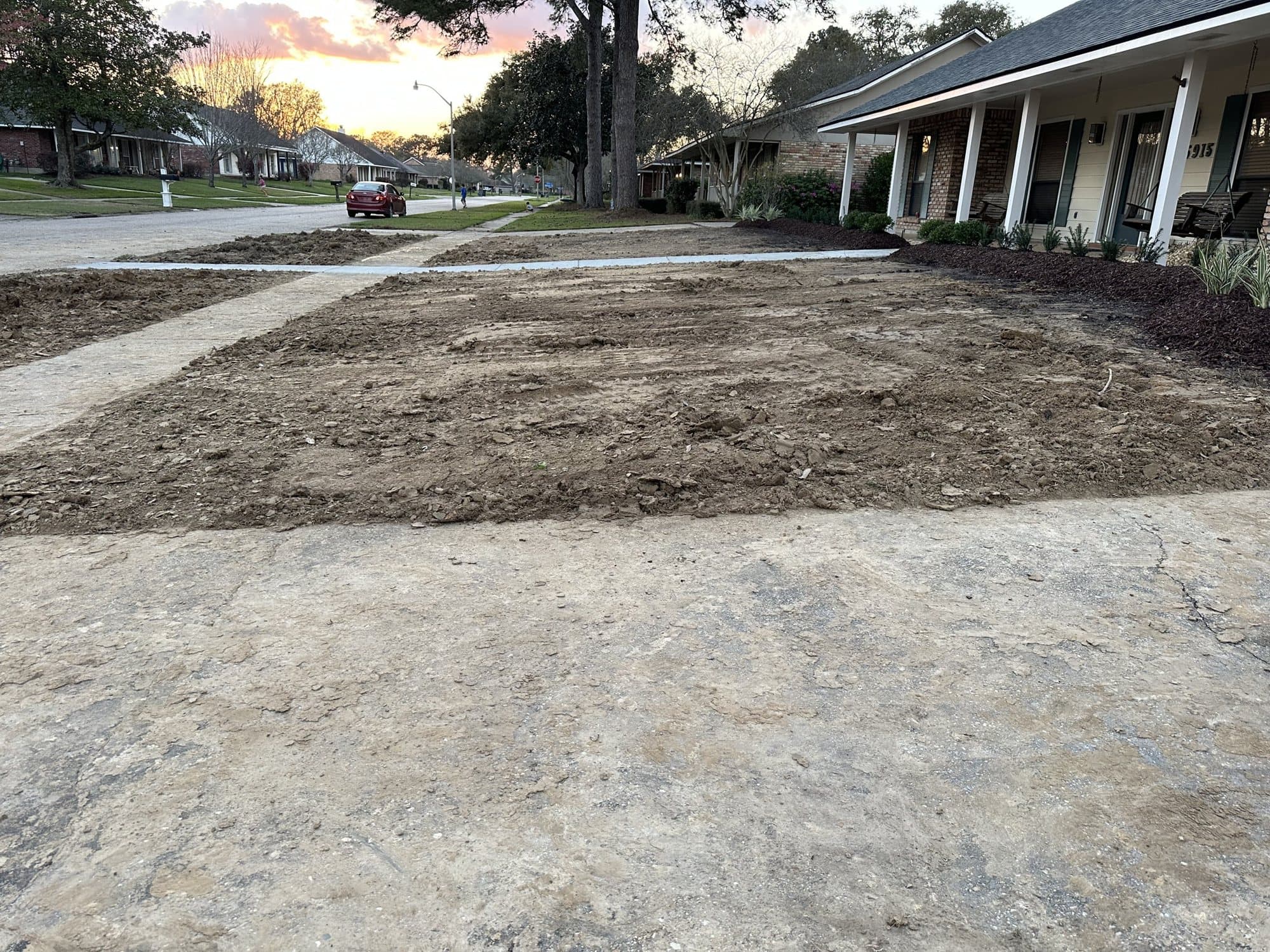 A backyard graded to bare soil before sod