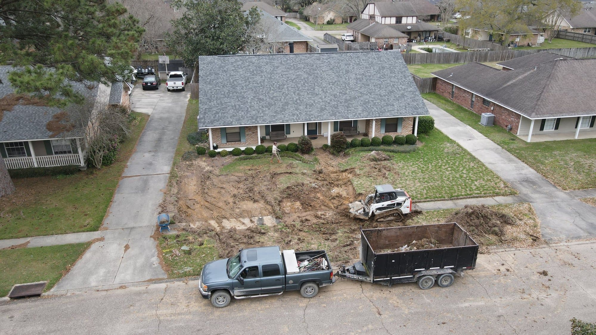 Aerial view of a front yard being stripped for new sod